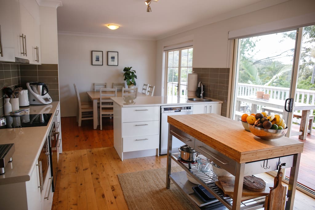 Open plan kitchen and dining room leading out onto back deck.