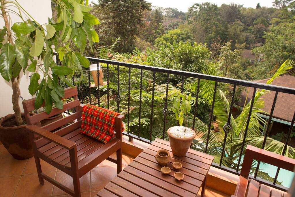 A view of the hills and the garden with pool.