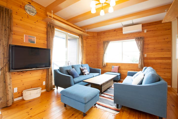 The living room has two three-seater sofas.