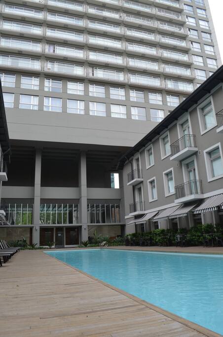 Apartment building in front, and the charming building on the right is where you will find a full spa, full gym, meeting rooms, small cinema among others cozy spaces.