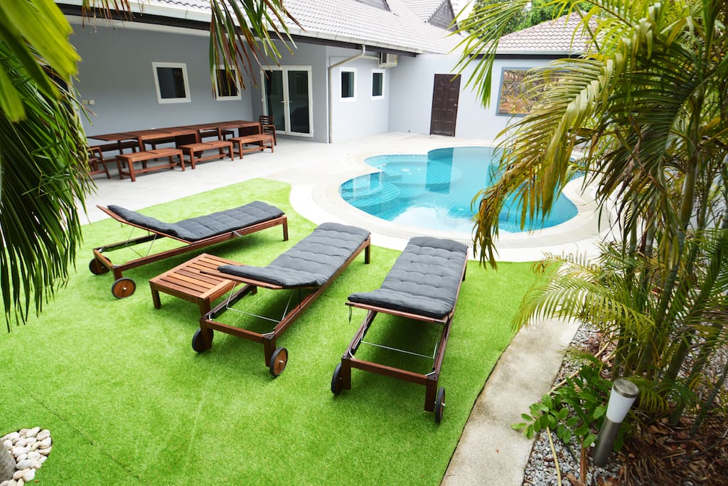 Private pool area with sunbeds