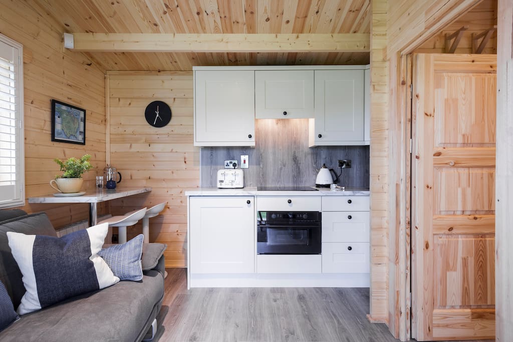 Open plan lounge, kitchen with dining area.