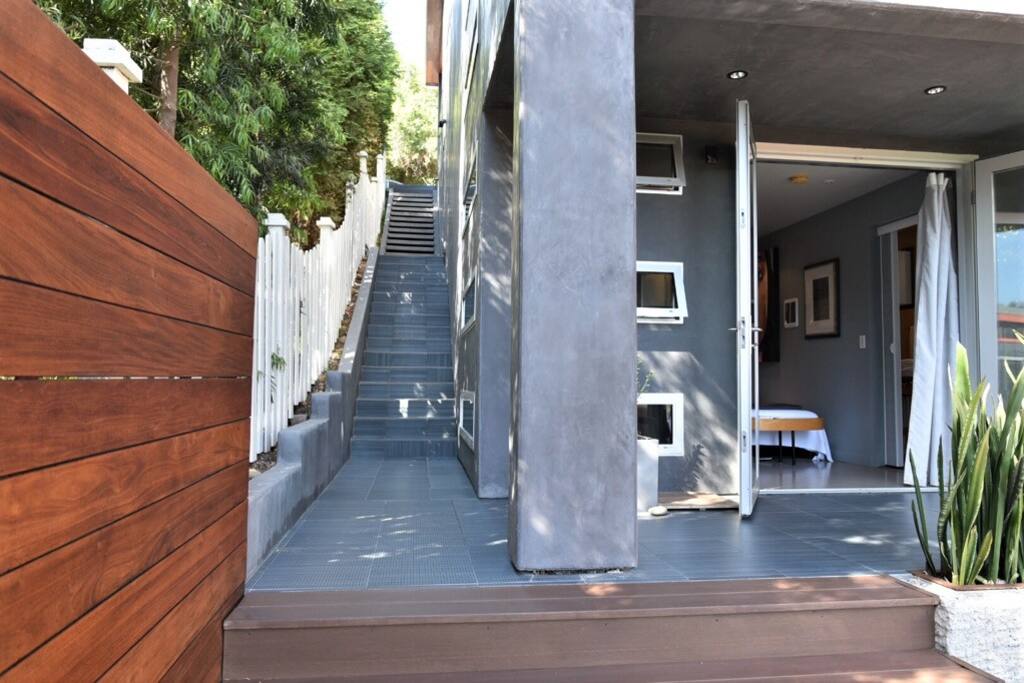 Stairs going down to studio w/doors opened to show studio entry