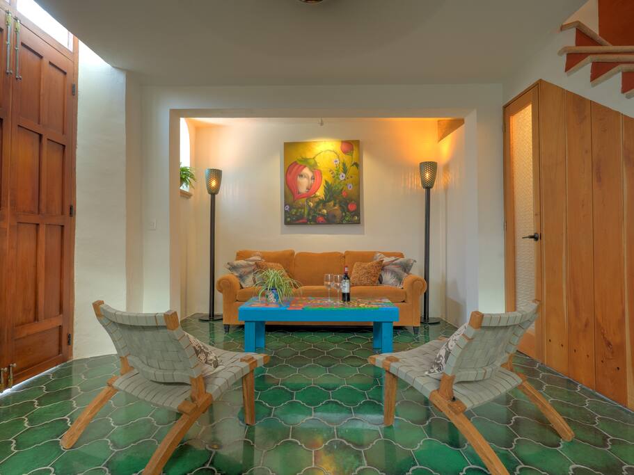 The living room features comfortable seating.