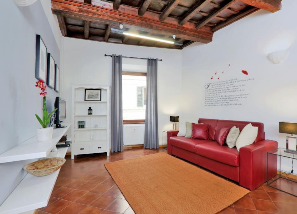 he living room contains a double sofa-bed,a flat screen TV, a DVD player and a striking dining table with seating for six guests.