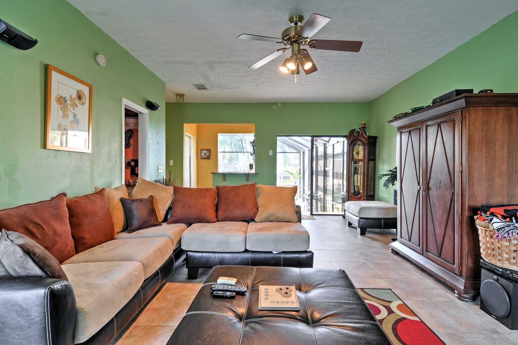 Plenty of comfortable seating for everyone in this home's vibrant interior.