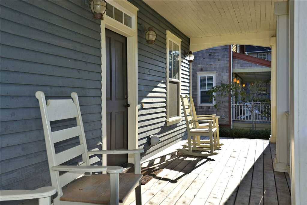 Front porch with four rocking chairs to enjoy the ocean breeze