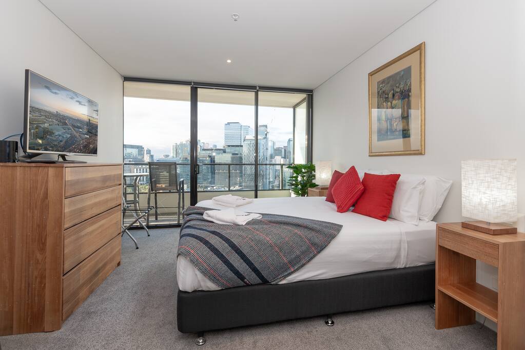TV in the master bedroom, comfortable beds and hotel linen
