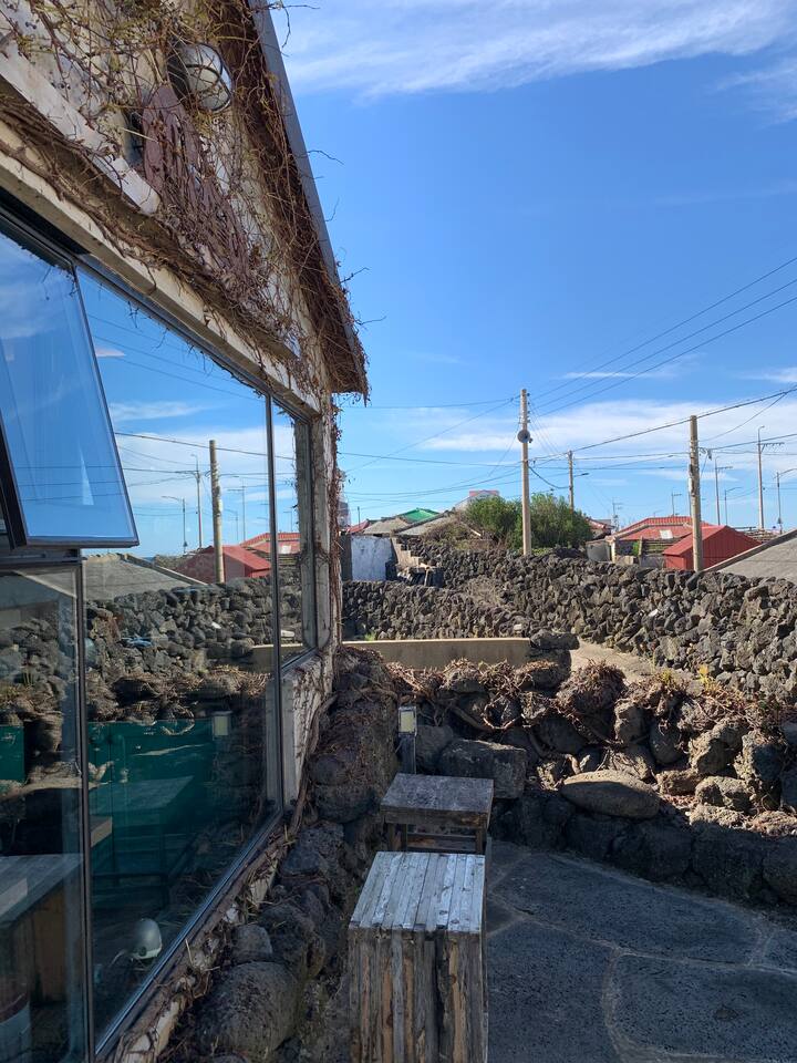 Stone House Embracing the jeju seas Cottages for Rent in Jejusi