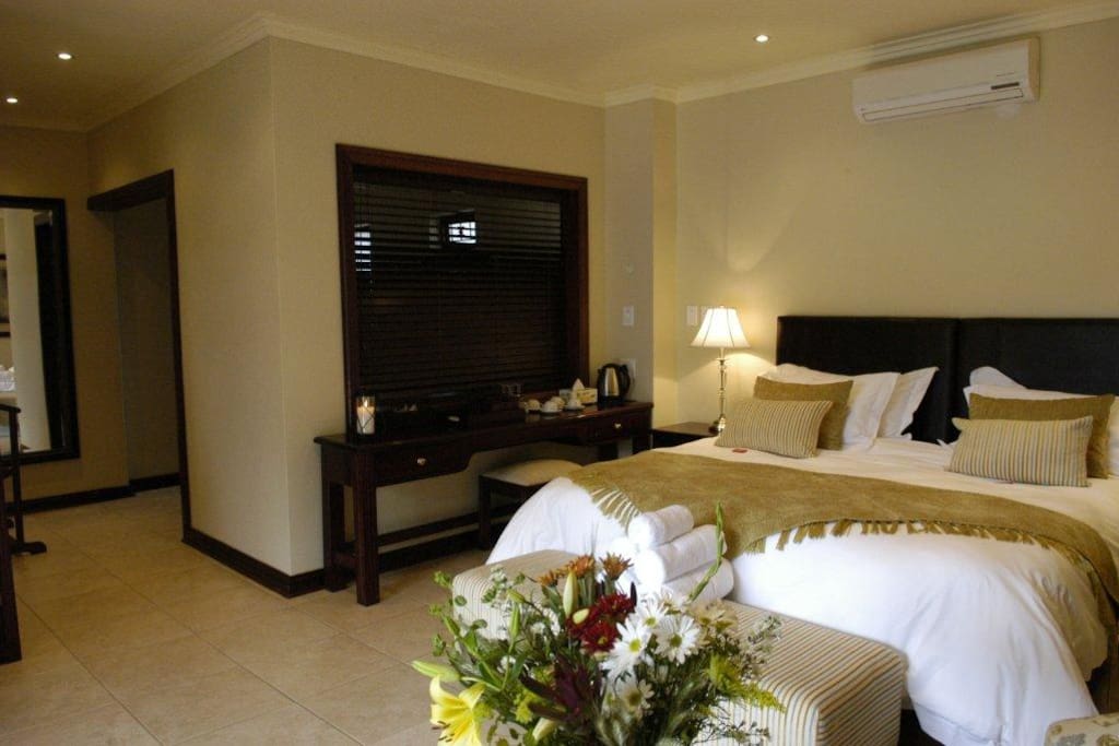 Luxury Standard Suites, en-suite bathroom, air-con, TV, bar fridge, kettle with coffee, tea, rusks. Sleeps 2 adults. Can be setup as 2 x singles or 1 x double bed. Extra cost on arrival for mattress on the floor for maximum 2 children u/10 years of age.