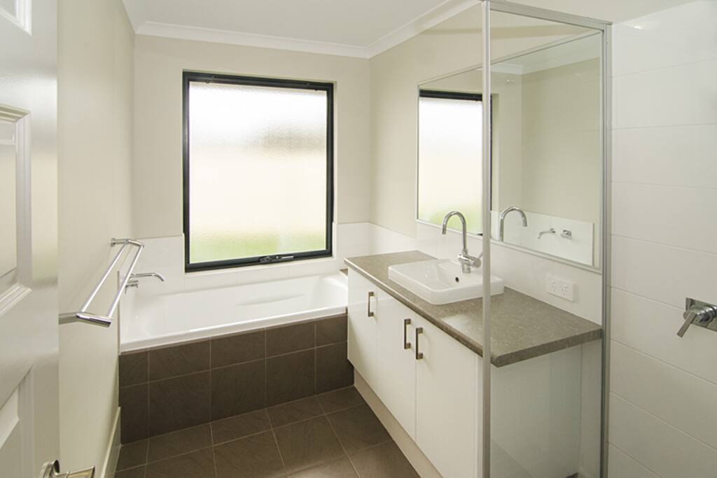 Childrens bathroom has bath