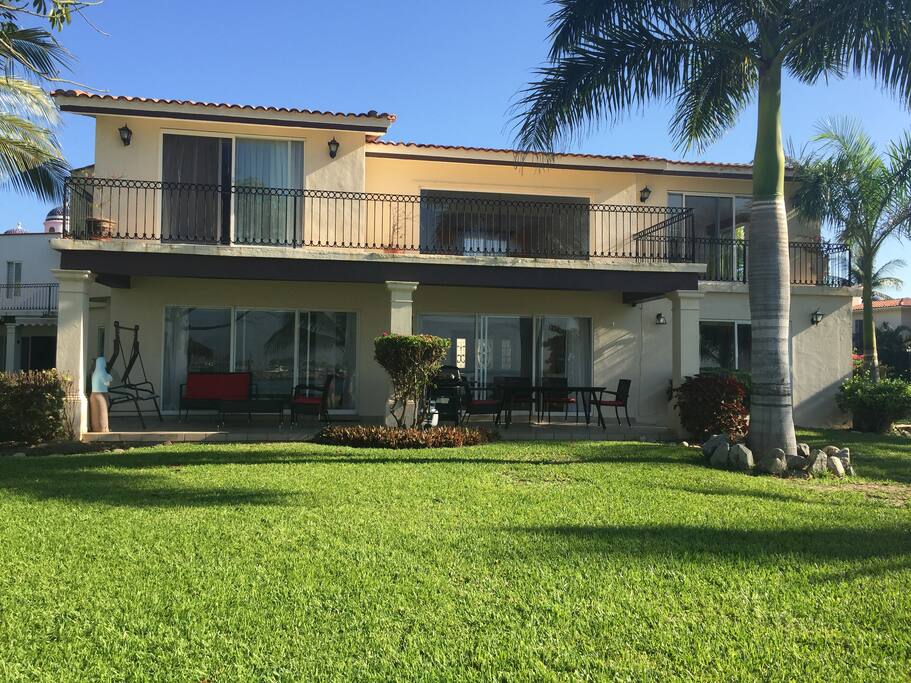 The house is in front the beach and the pool