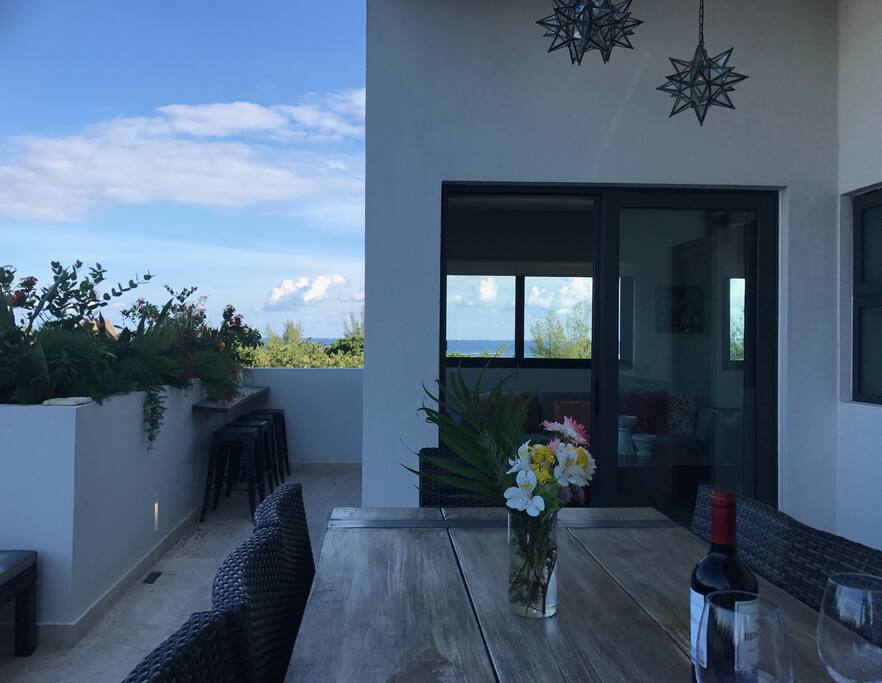 My favorite place for a cup of coffee or a glass of wine is this amazing spot overlooking the birds in the trees just below.
