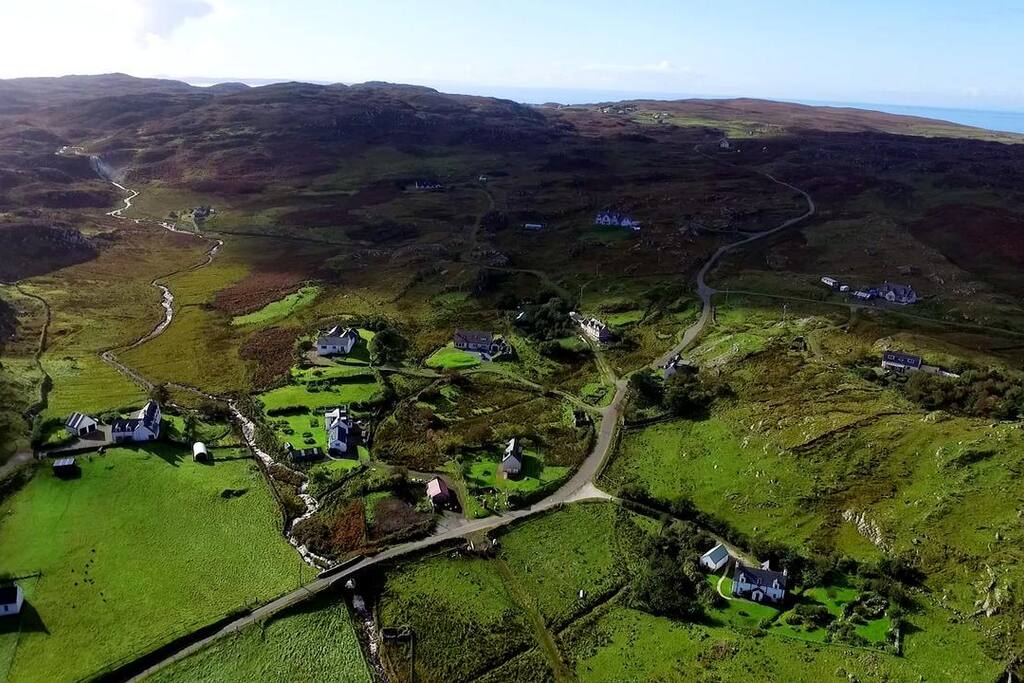 Aerial view of Clashnessie. Our house is to the left of the photo at the top of the large green field. The big waterfall is up the Strath, just visible at the top left of the photo
