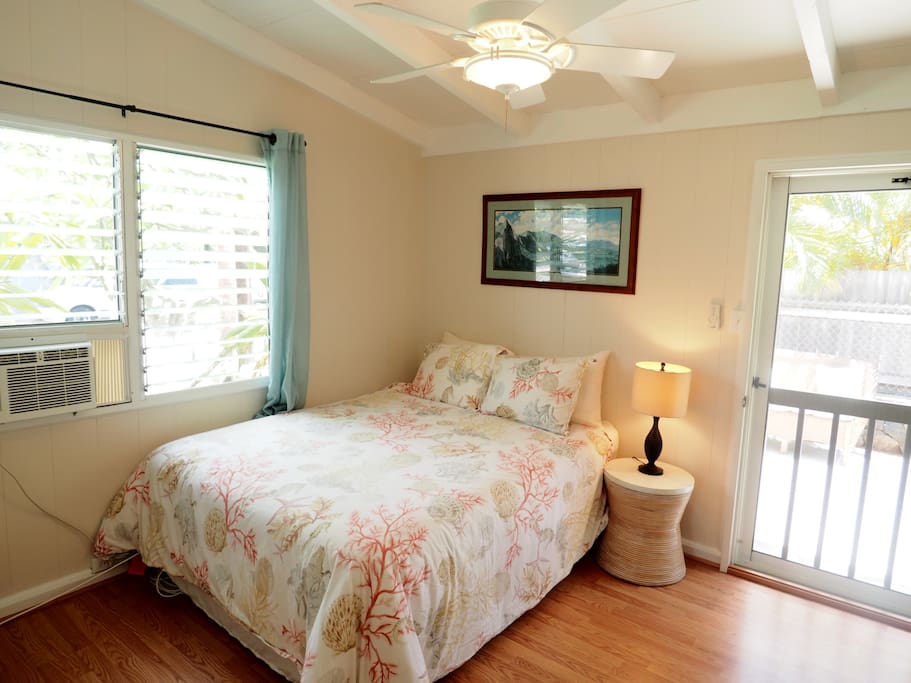 Sleeping Area with queen size bed, ceiling fan and window a/c.