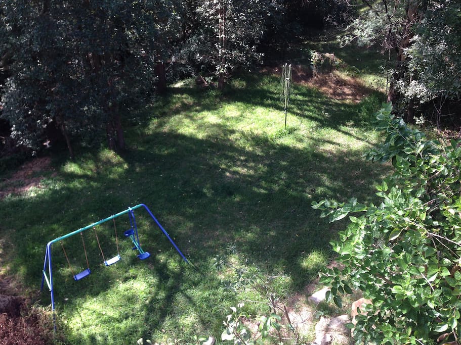 Back garden and swing set.