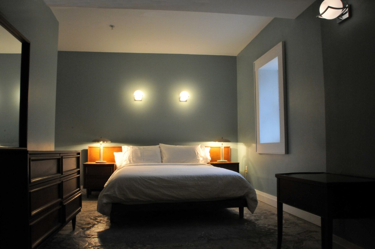 The Lake Level apartment has a queen bed, a full four piece ensuite bathroom and a small kitchen. 
