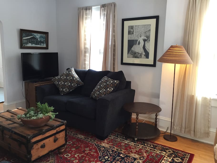 TV cabinet rolls out; top swivels so you can position TV for comfortable viewing.