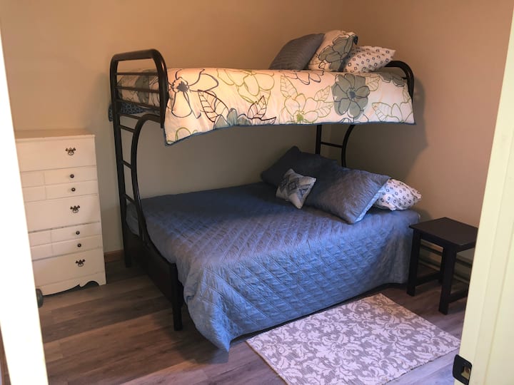 The third bedroom features a double + twin bunk bed, spacious closet and dresser. 