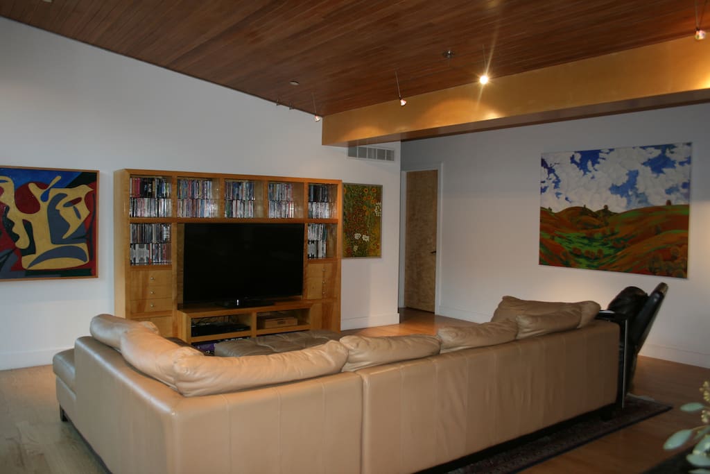 A 60 inch 4K TV with Direct TV, Netflix and a huge DVD library for your viewing pleasure in the family room.