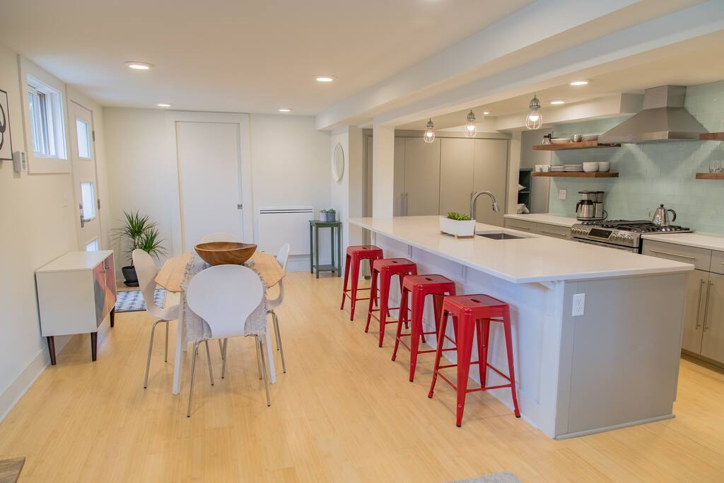 The main area is open, bright, full of natural light and has plenty of seating and storage space for your stay.