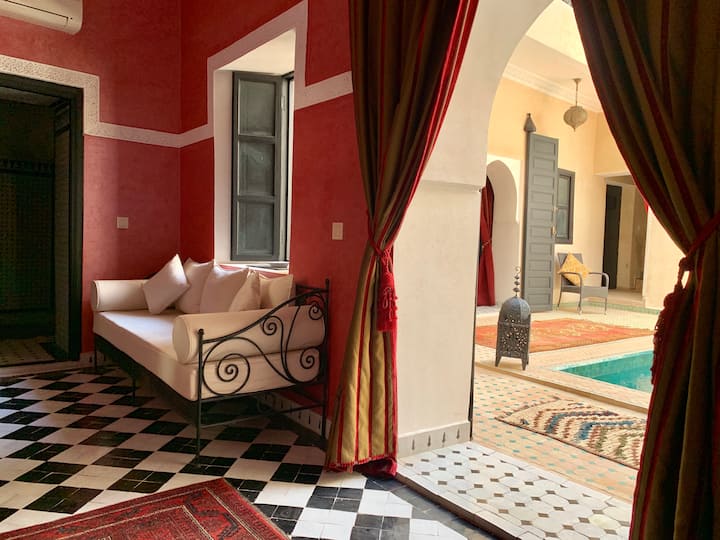 The view of the front door and pool / courtyard area as seen from the Argan room. 