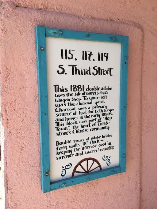 Historic description of Pink Adobe, roses under deck are cuttings from the world's largest, the Rosa Banksiae, over 130 years old