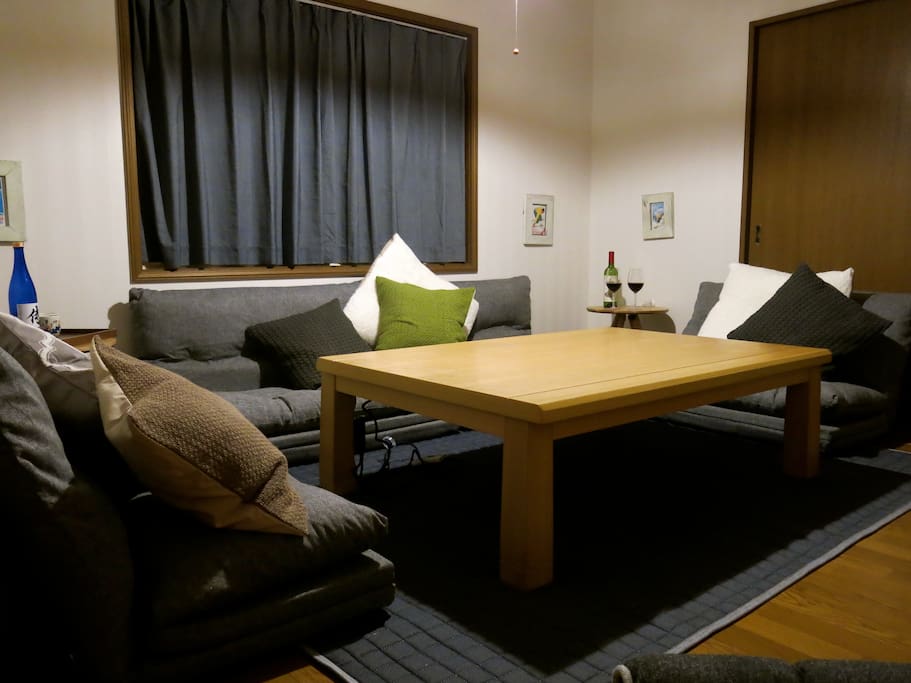 The family room. The house features a separate family room upstairs with tv, dvd player, futon chairs and a kotatsu table (table has built in heater underneath, and a fleece blanket that fits under the table top for warming toes). The ultimate apres ski lounge!