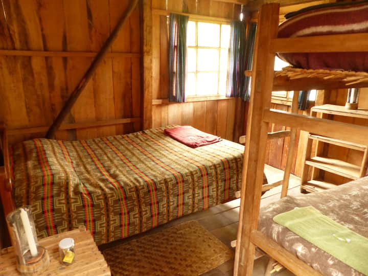 Room with double bed and bunk beds. 