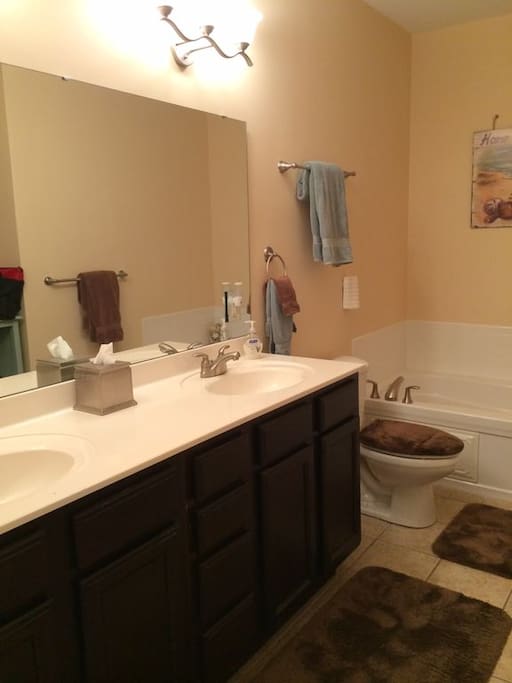 Master Bath with double sinks, soaking tub, and separate shower