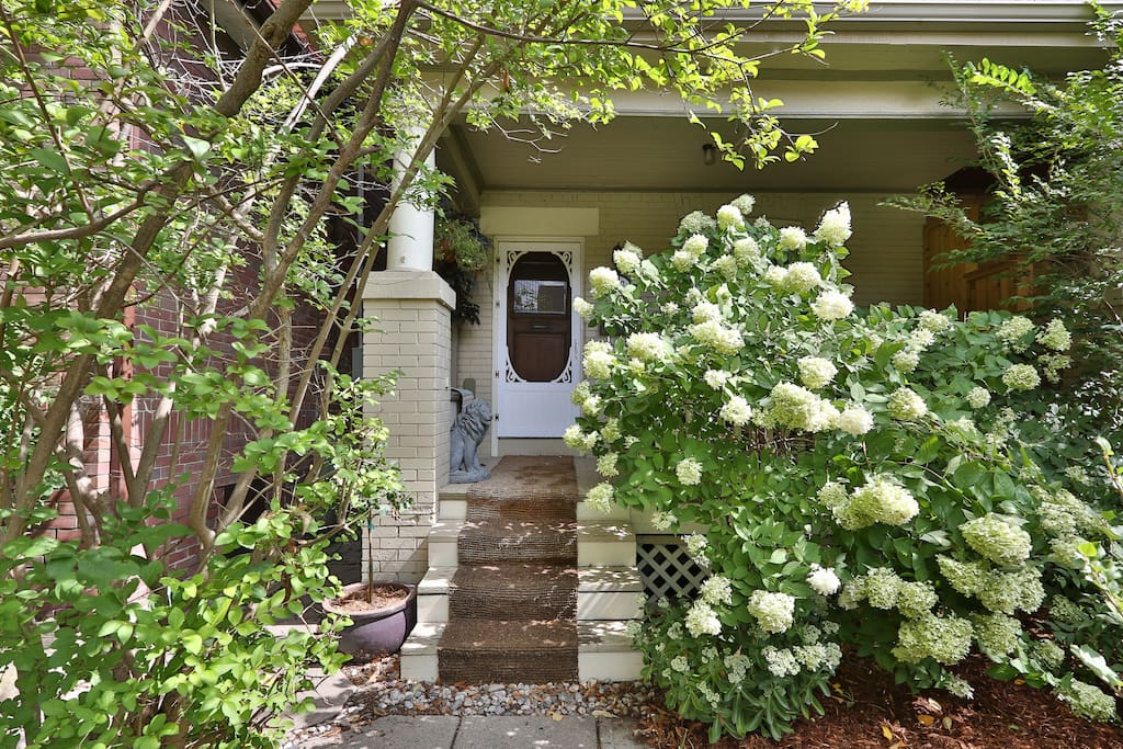 Welcome to your bright main level front entrance! Enjoy your morning coffee or evening glass of wine on the front porch with seating for two.