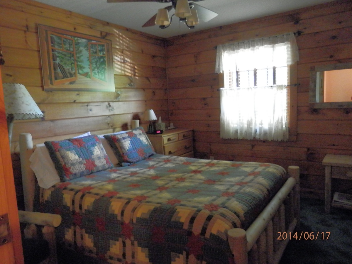Room with two twin beds and private bath.