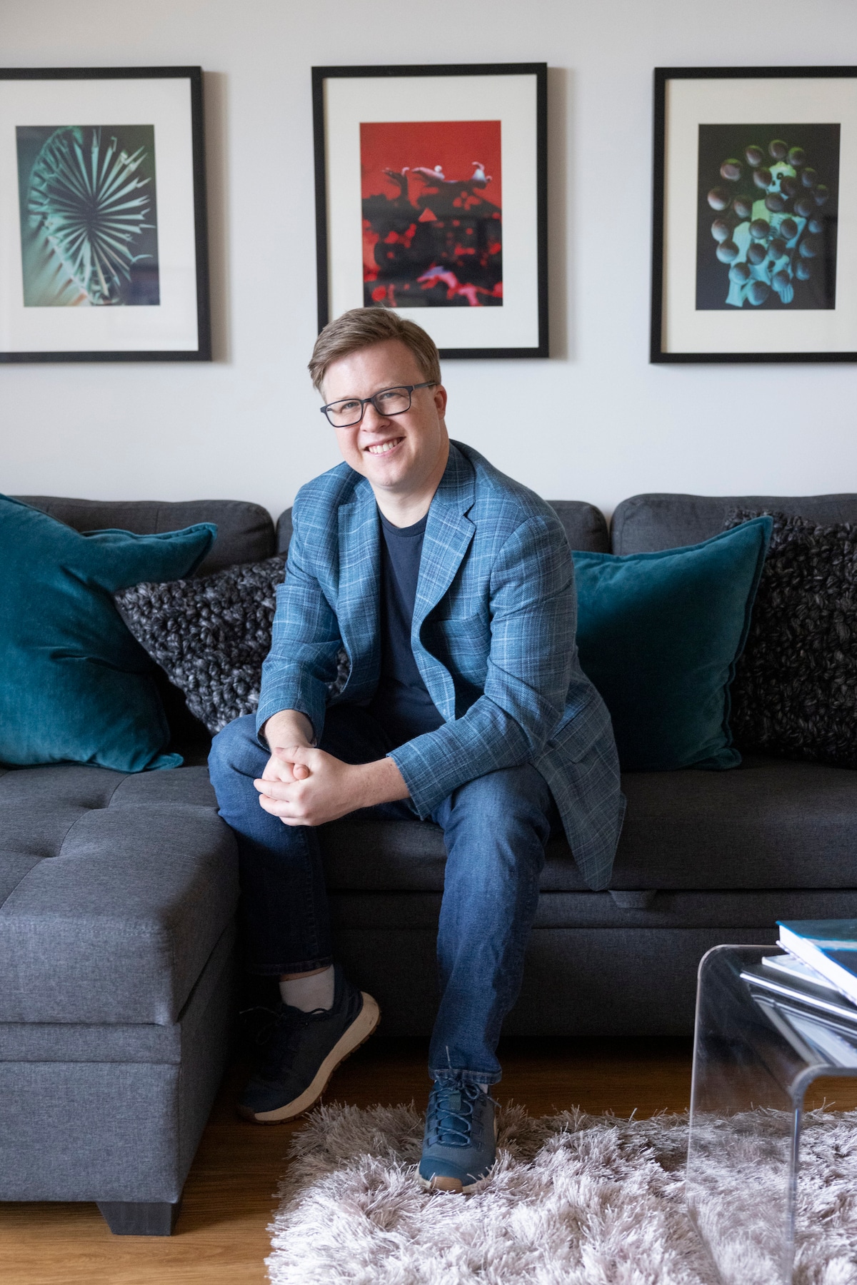 Image of Andrew sitting at a couch