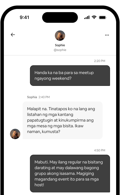 Makikita sa phone ang one‑on‑one na thread ng mensahe ng dalawang host na nagpaplano ng meetup.