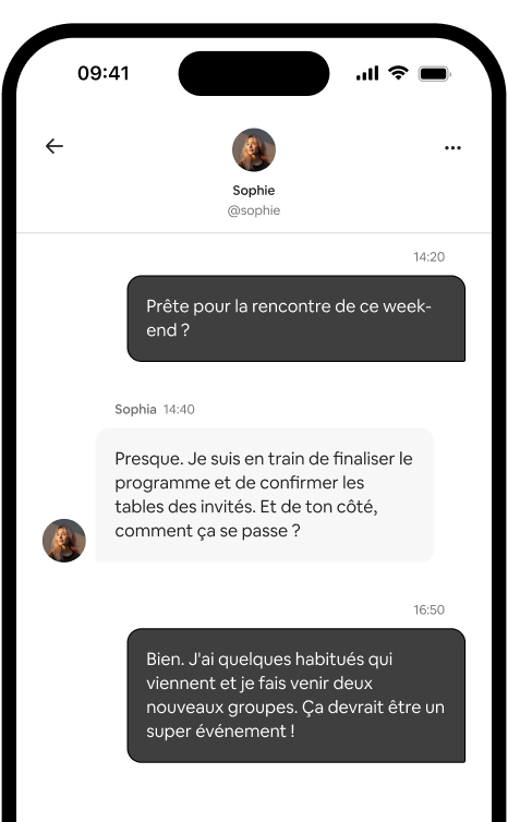Un téléphone affiche une conversation privée entre deux hôtes qui organisent une rencontre.