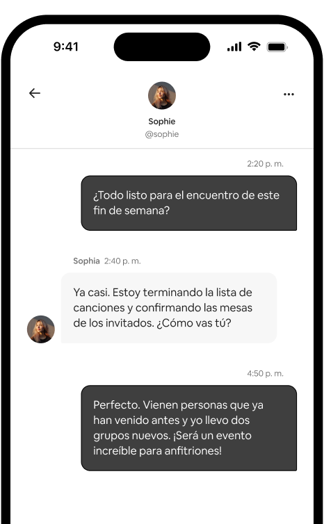 Un teléfono muestra un hilo de mensajes individual entre dos anfitriones que coordinan un encuentro.