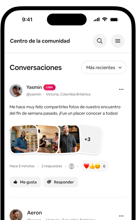 Un teléfono muestra un feed de Conversaciones con una publicación con foto de un anfitrión y las reacciones de la comunidad.