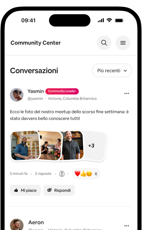 Telefono che mostra un feed di conversazioni con un post fotografico dell'host e le reazioni della community.