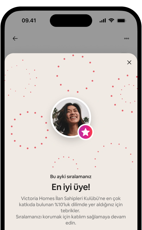 Telefon ekranında bir ilan sahibinin avatarı ve seviye rozetiyle birlikte En başarılı üye kutlama penceresi gösteriliyor.
