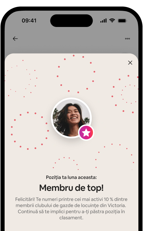 Telefon care afișează o fereastră modală de recunoaștere a unui membru de top, cu un avatar de gazdă și o insignă de rang.