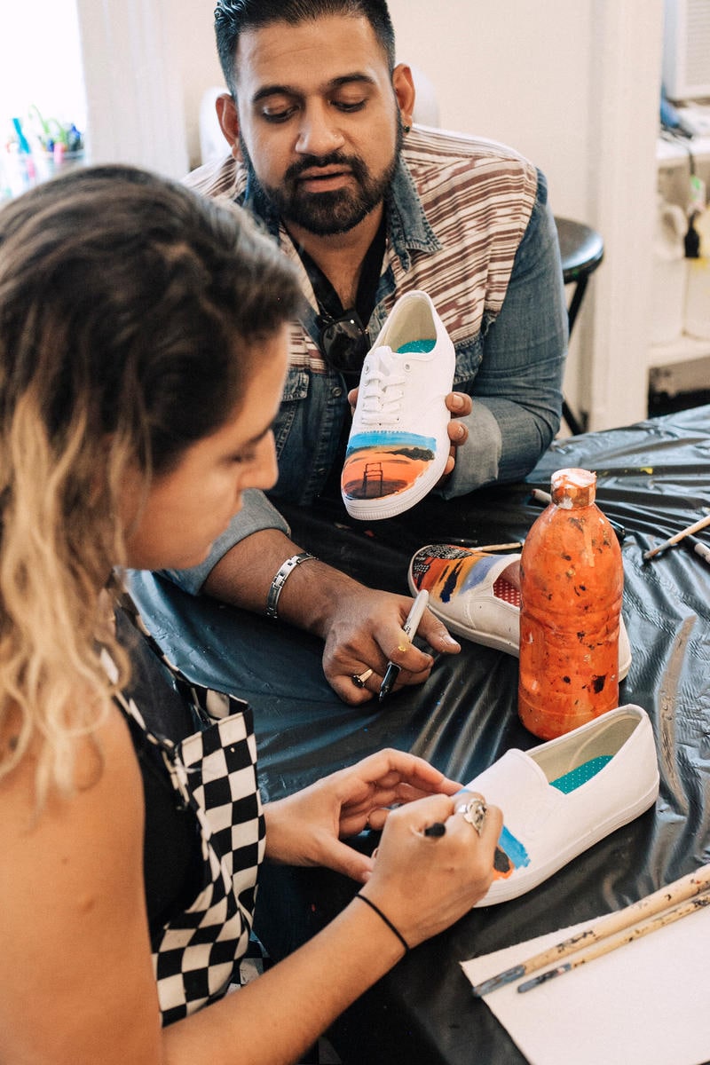 Paint sneakers in a shaded courtyard