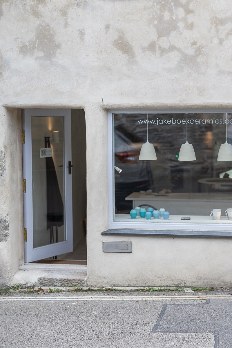 Throw a cup on the potters wheel with a ceramist