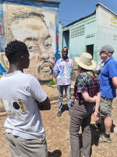 Admire Kibera's street art with local artists