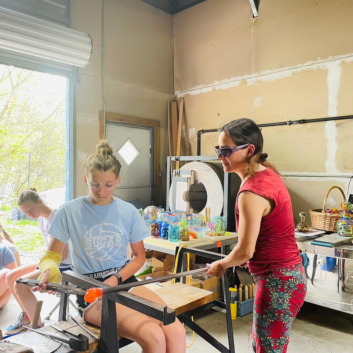Blow your own glass piece in a glass studio