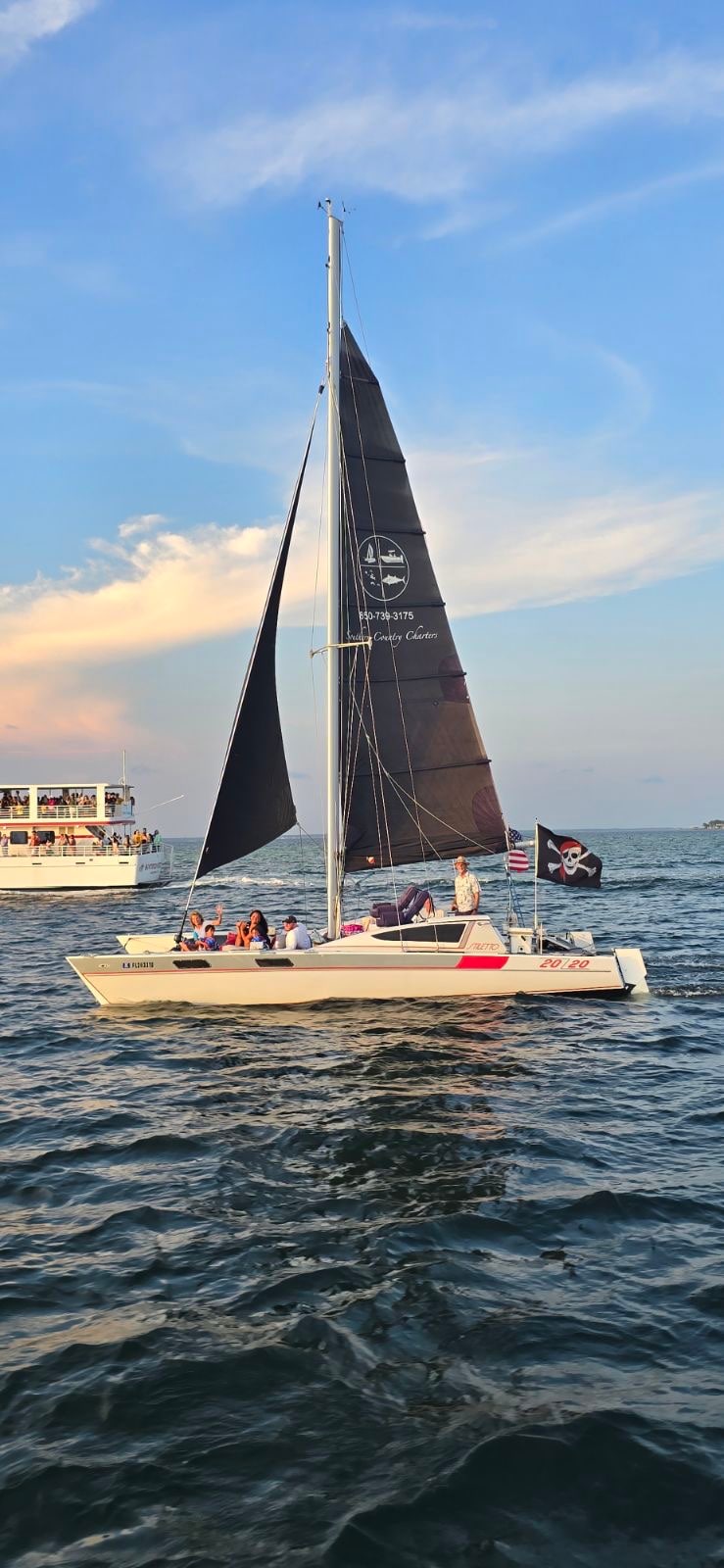 Sail at sunset on a catamaran in Destin