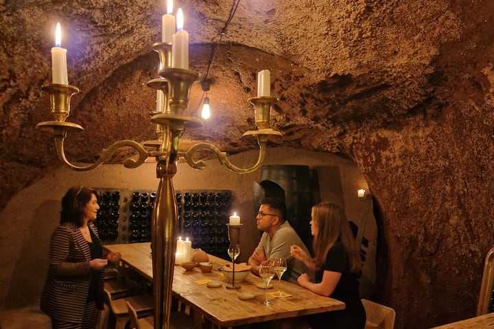 Drink wine by candlelight in an ancient cave