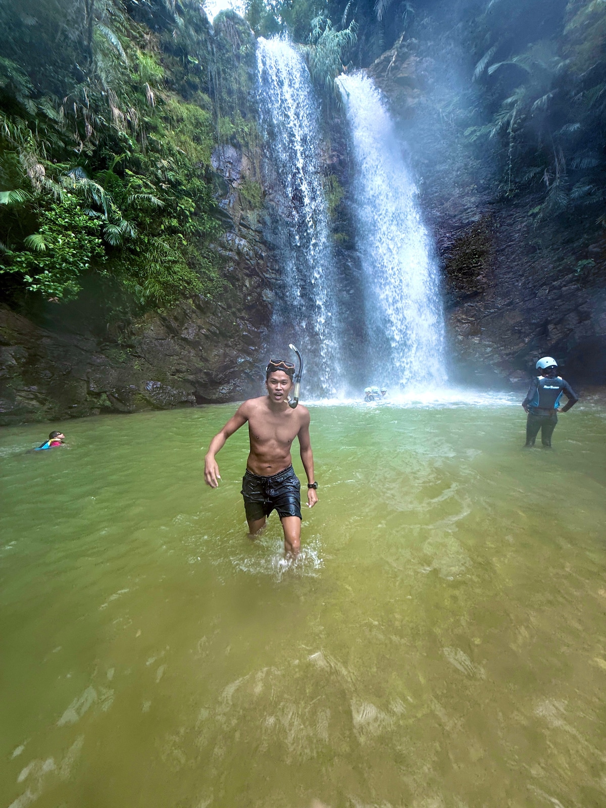 River trekking to a secluded waterfall