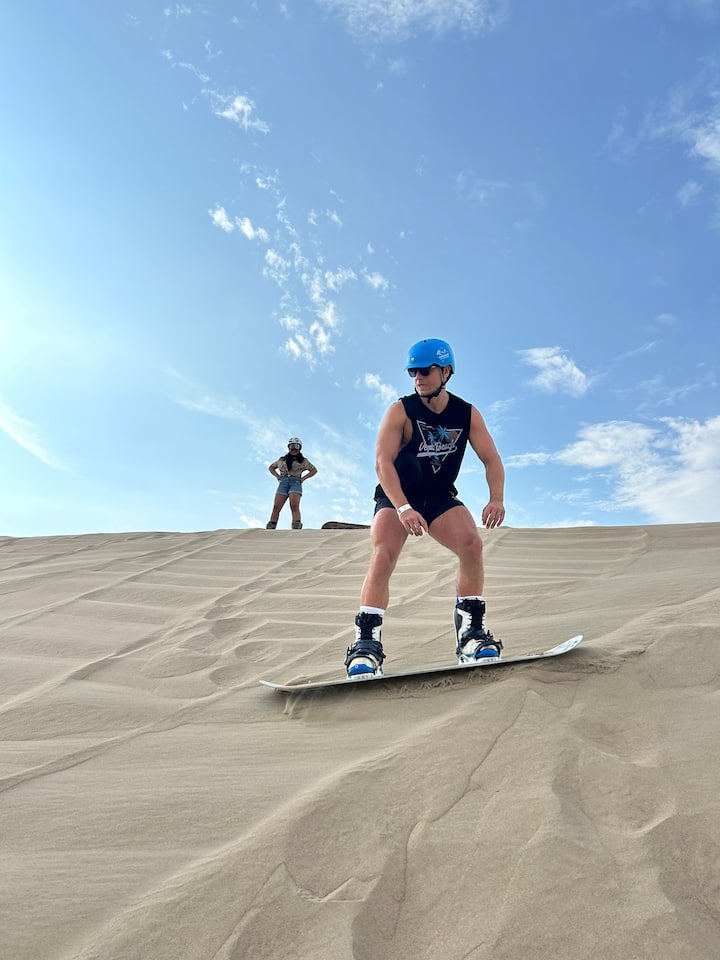 Sandboarding or Sandsky with professional equipment