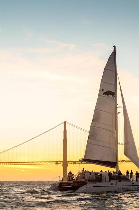 Sail a catamaran at sunset