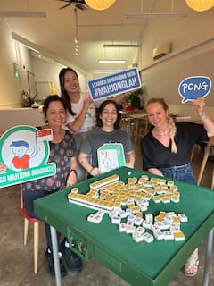 Learn to play Singapore Mahjong in a local home